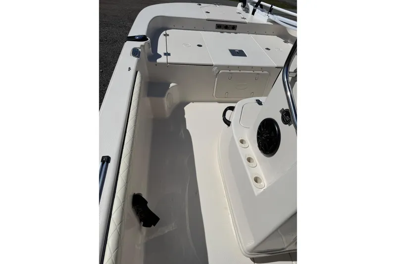 Slide: The Image of 2023 Carolina Skiff 19 LS boat interior with seating and storage compartments. - 17