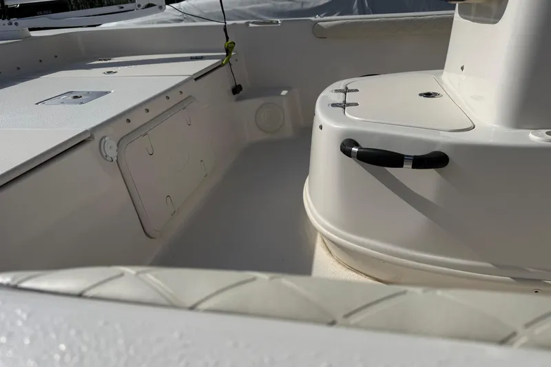 Slide: The Image of 2023 Carolina Skiff 19 LS boat interior, featuring storage compartments and seating area. - 3