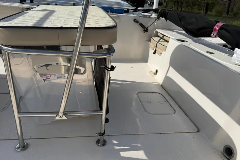 Slide: The Image of 2023 Carolina Skiff 19 LS boat interior with seating and storage compartments. - 4