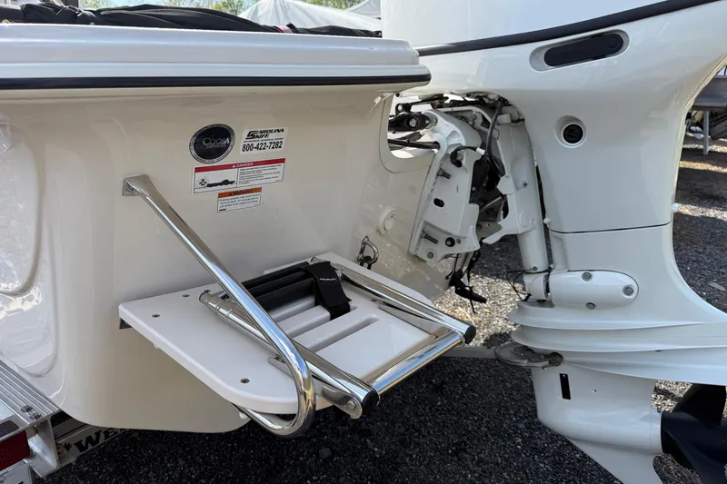 Slide: The Image of 2023 Carolina Skiff 19 LS boat stern with motor and swim ladder. - 7