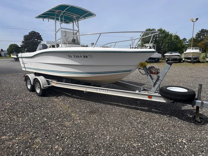 The Image of 2005 Key Largo 20 boat on trailer parked outdoors. - 0