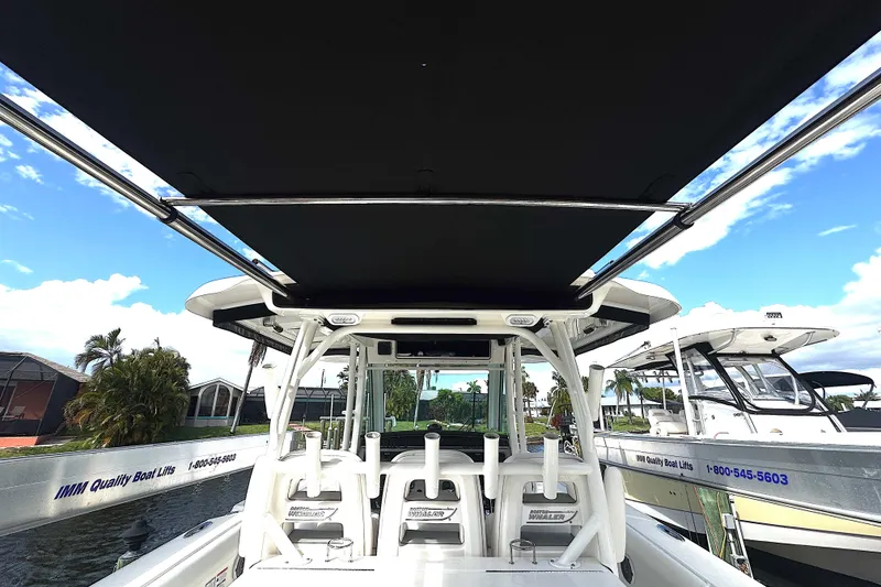 Slide: The Image of 2014 Boston Whaler 350 Outrage boat interior with canopy. - 44
