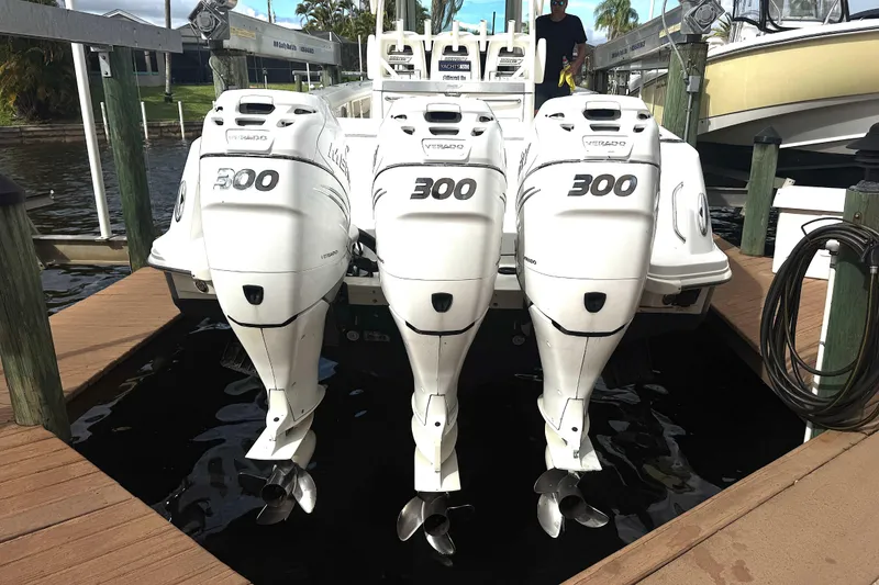 Slide: The Image of 2014 Boston Whaler 350 Outrage with triple 300 horsepower engines. - 49
