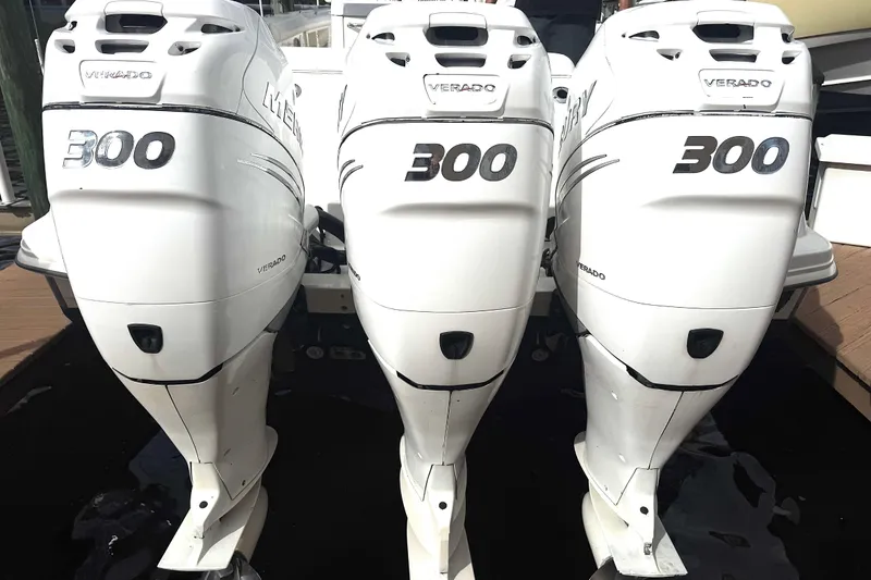 Slide: The Image of Triple Mercury Verado 300 engines on a 2014 Boston Whaler 350 Outrage boat. - 50