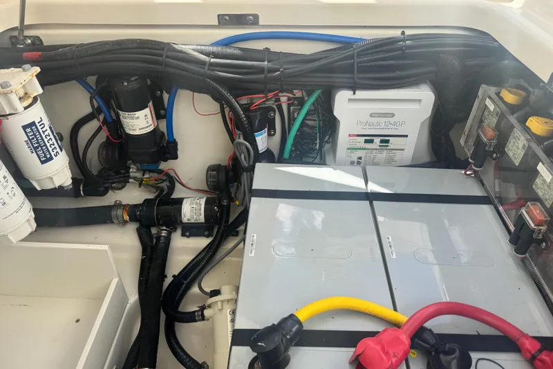Slide: The Image of Electrical and mechanical components inside a 2014 Boston Whaler 350 Outrage boat. - 54