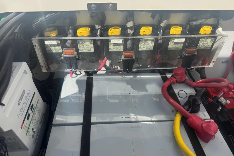 Slide: The Image of Electrical system of a 2014 Boston Whaler 350 Outrage boat, featuring battery connections. - 57