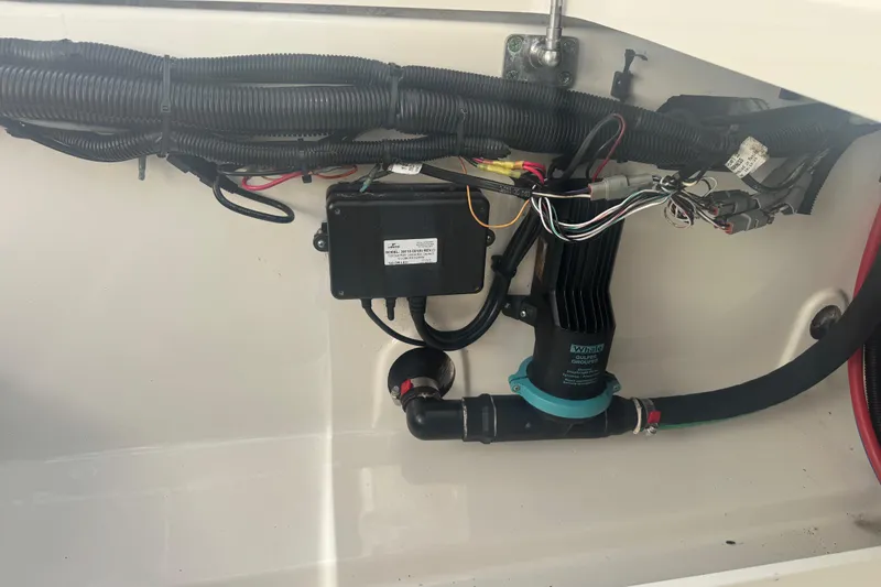Slide: The Image of Electrical wiring and components inside a 2014 Boston Whaler 350 Outrage boat. - 58