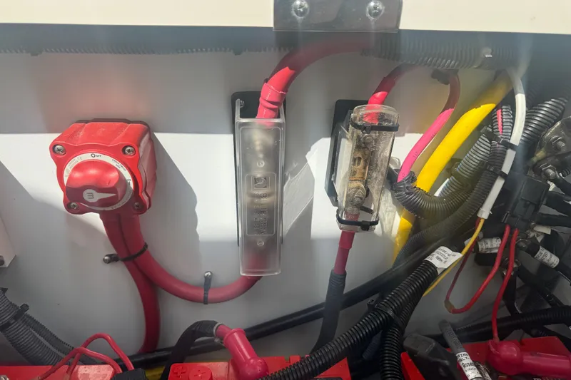 Slide: The Image of Electrical components and wiring inside a 2014 Boston Whaler 350 Outrage boat. - 59