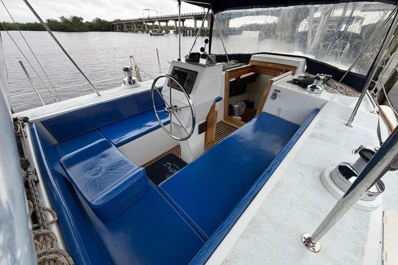 Slide: The Image of Cockpit of 2011 Custom Build 50' Ketch, featuring blue seating and steering wheel. - 17