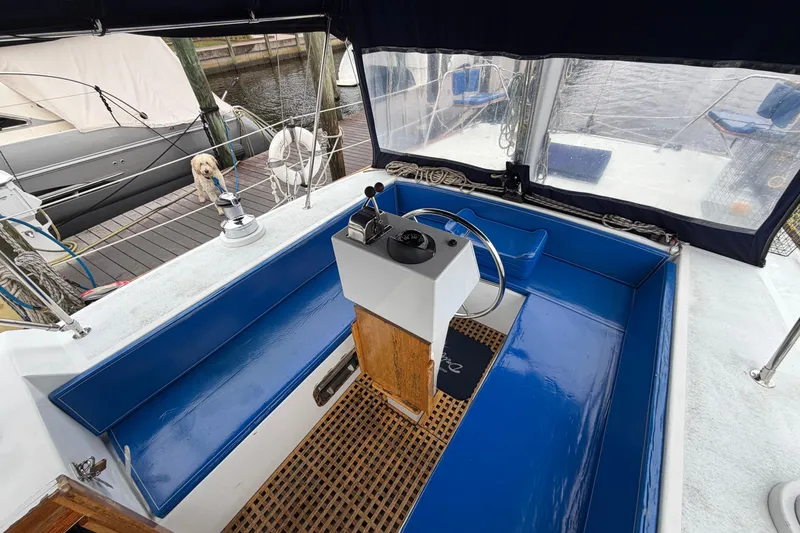 Slide: The Image of Cockpit of 2011 Custom Build 50' Ketch, featuring blue seating and steering wheel. - 20