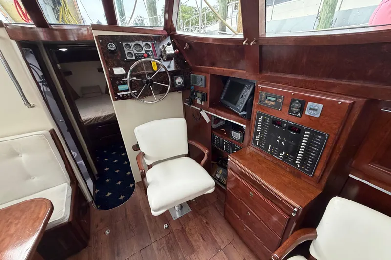 Slide: The Image of Pilothouse interior of 2011 Custom Build 50' Ketch, featuring navigation equipment and seating. - 27