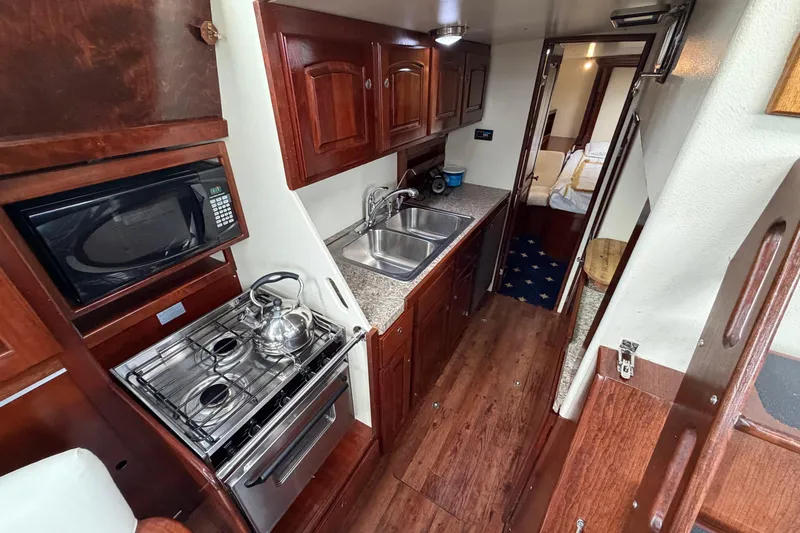 Slide: The Image of Luxurious 2011 Custom Build 50' Ketch interior with modern kitchen and cozy cabin. - 29