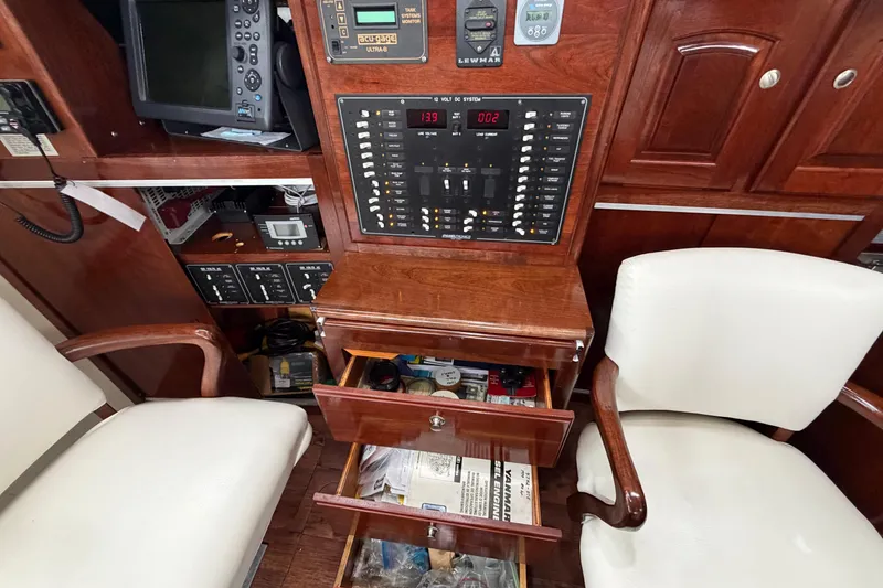 Slide: The Image of Interior of 2011 Custom Build 50' Ketch, featuring control panel and seating. - 31
