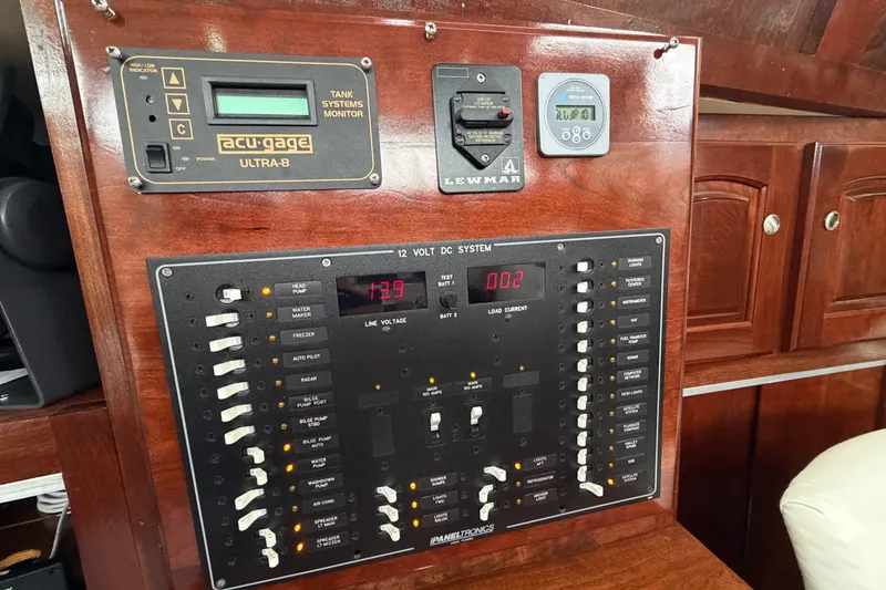 Slide: The Image of Electrical control panel on a 2011 Custom Build 50' Ketch, featuring various system monitors. - 33