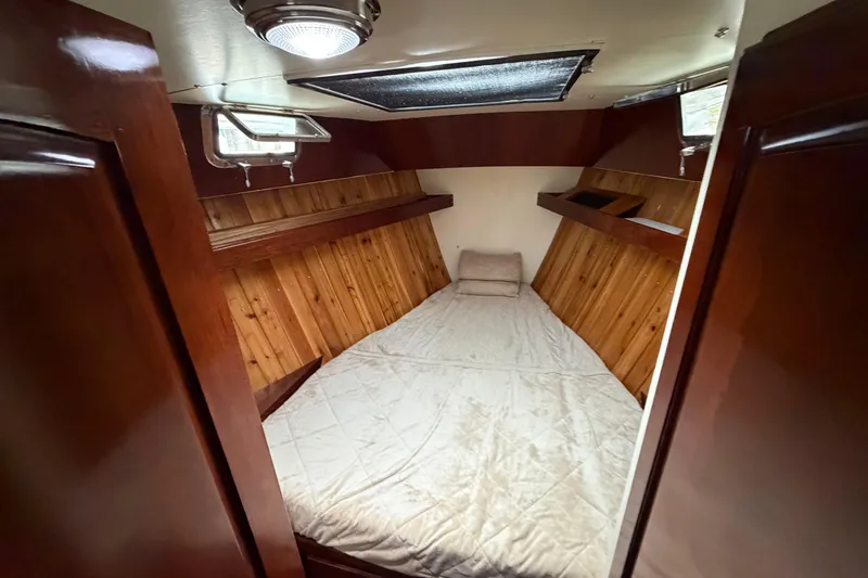 Slide: The Image of Cozy cabin interior of 2011 Custom Build 50' Ketch, featuring wooden paneling and a comfortable bed. - 42
