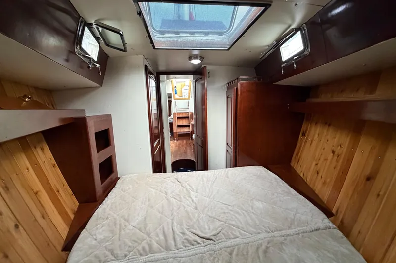 Slide: The Image of Interior of 2011 Custom Build 50' Ketch, featuring cozy wooden cabin and skylight. - 44