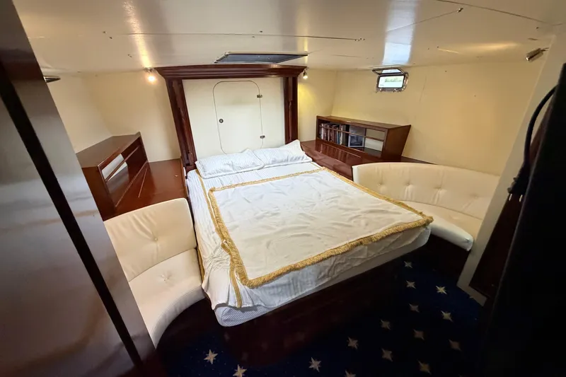 Slide: The Image of Luxurious cabin interior of 2011 Custom Build 50' Ketch, featuring elegant bedding and seating. - 46