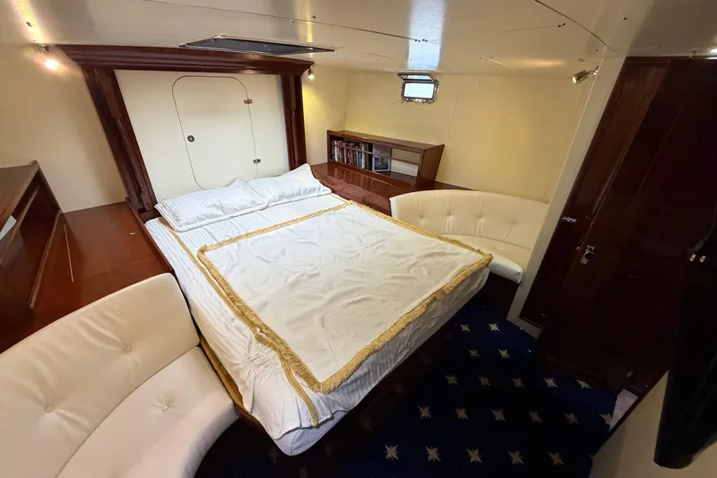 Slide: The Image of Luxurious cabin interior of 2011 Custom Build 50' Ketch, featuring elegant bedding and seating. - 47