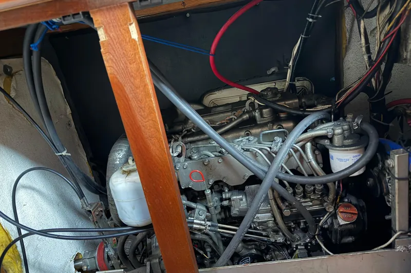 Slide: The Image of Engine compartment of a 2011 Custom Build 50' Ketch, showcasing intricate wiring and components. - 59