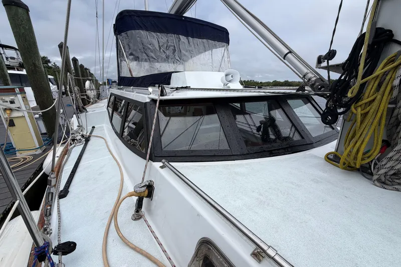 Slide: The Image of Custom Build 50' Ketch, 2011 Earl Retmaster, Bruce Roberts 434 Pilothouse, docked with rigging visible. - 9