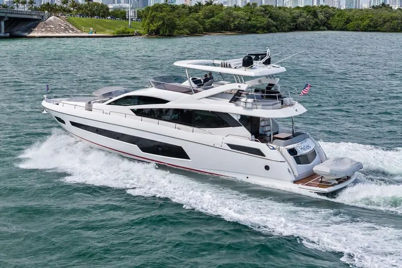 Slide: The Image of 2018 Sunseeker 75 Sport Yacht cruising on blue water, showcasing sleek design and luxury. - 10