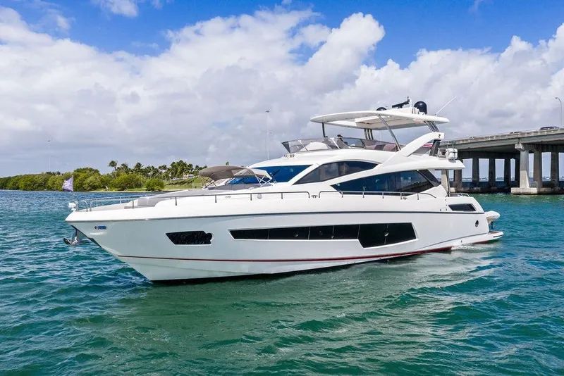 Slide: The Image of 2018 Sunseeker 75 Sport Yacht cruising near a bridge on a sunny day. - 11