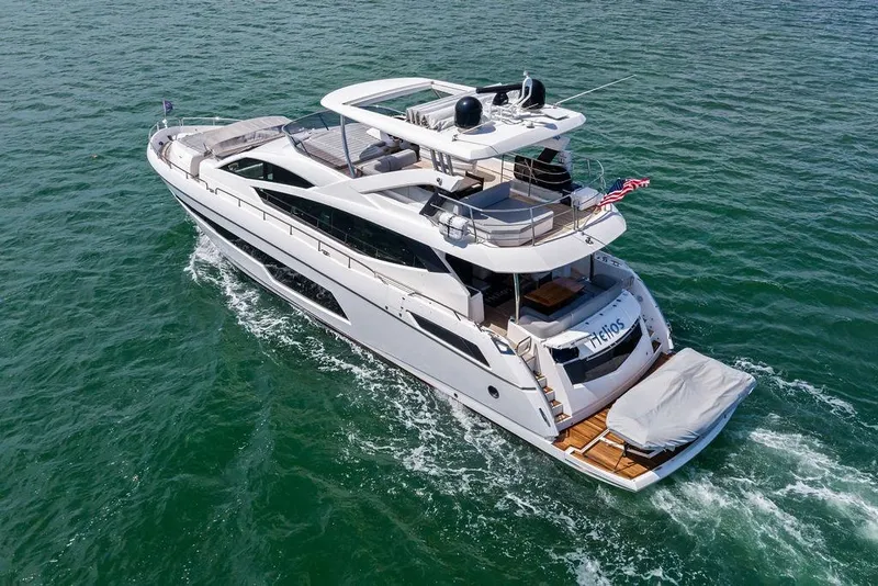 Slide: The Image of 2018 Sunseeker 75 Sport Yacht cruising on open water, showcasing sleek design and luxury features. - 14