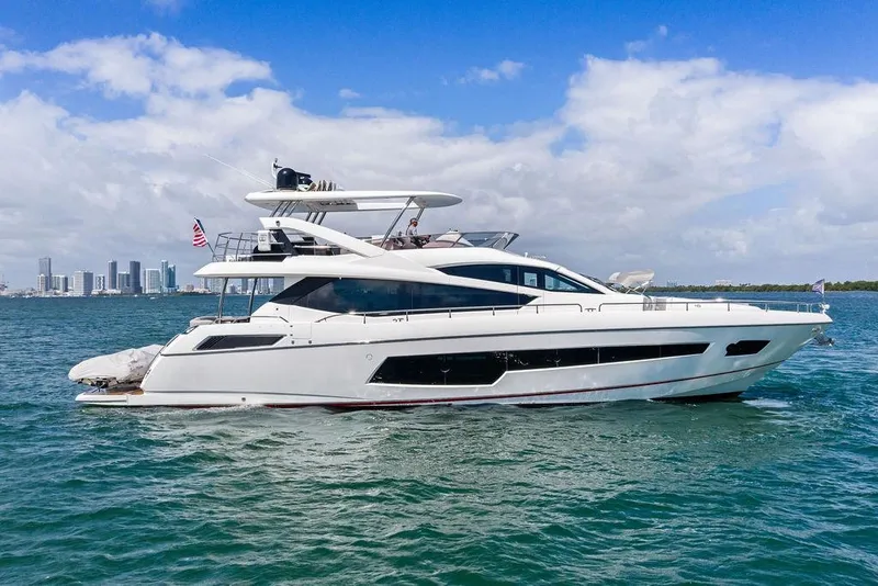 Slide: The Image of 2018 Sunseeker 75 Sport Yacht cruising on blue waters under a clear sky. - 17