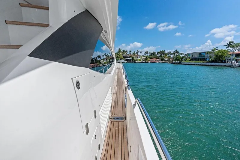 Slide: The Image of Side view of a 2018 Sunseeker 75 Sport Yacht cruising on a sunny day. - 23