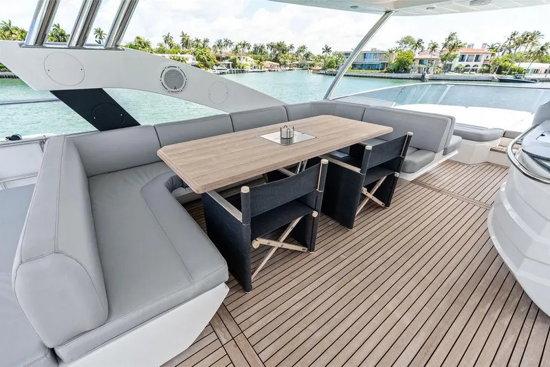 Slide: The Image of Luxurious Sunseeker 75 Sport Yacht 2018 deck with elegant seating and dining area. - 26