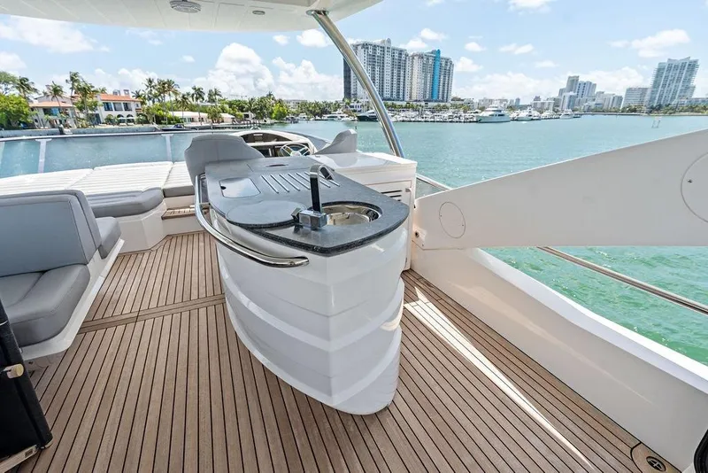 Slide: The Image of Luxurious Sunseeker 75 Sport Yacht 2018 deck with sleek design and waterfront view. - 28