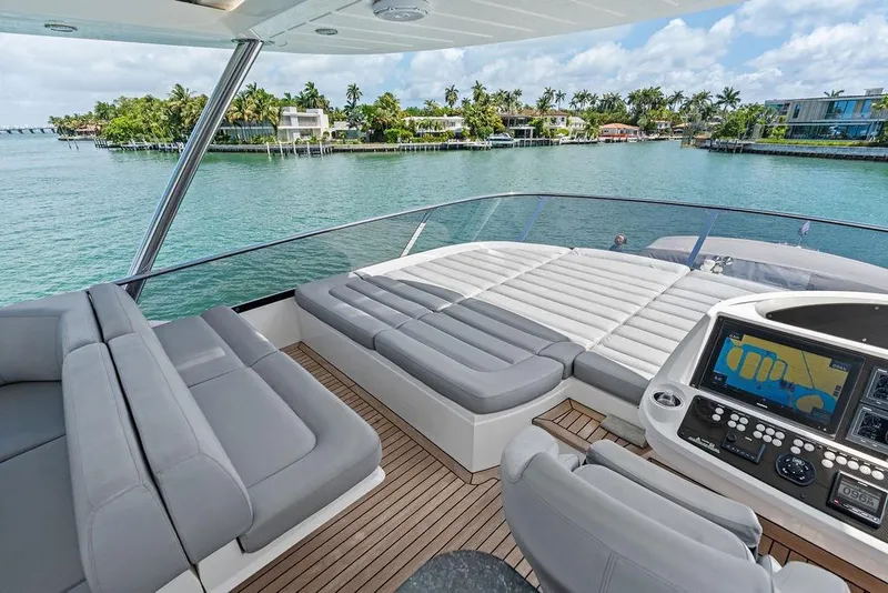 Slide: The Image of Luxurious Sunseeker 75 Sport Yacht 2018 with spacious deck and scenic waterfront view. - 31