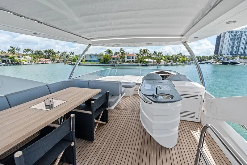 Slide: The Image of Luxurious 2018 Sunseeker 75 Sport Yacht deck with seating and ocean view. - 33