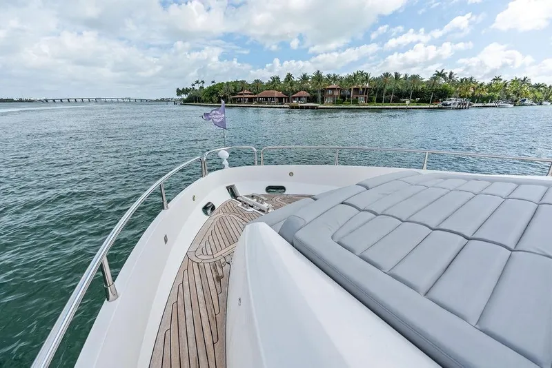 Slide: The Image of Bow view of 2018 Sunseeker 75 Sport Yacht cruising near tropical shoreline. - 36