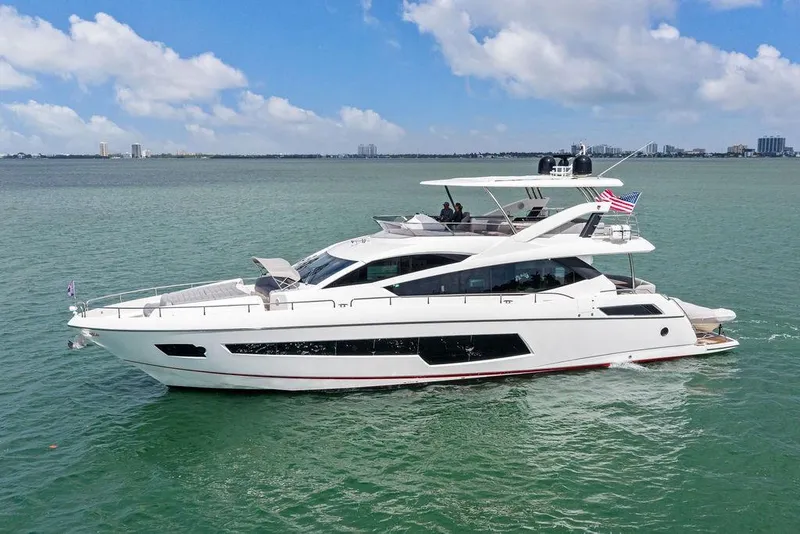 Slide: The Image of 2018 Sunseeker 75 Sport Yacht cruising on calm waters under a clear sky. - 4