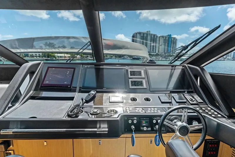 Slide: The Image of Cockpit of 2018 Sunseeker 75 Sport Yacht with modern navigation equipment and steering wheel. - 43