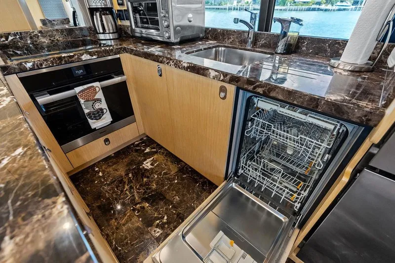 Slide: The Image of Luxurious kitchen in 2018 Sunseeker 75 Sport Yacht with marble countertops and modern appliances. - 45
