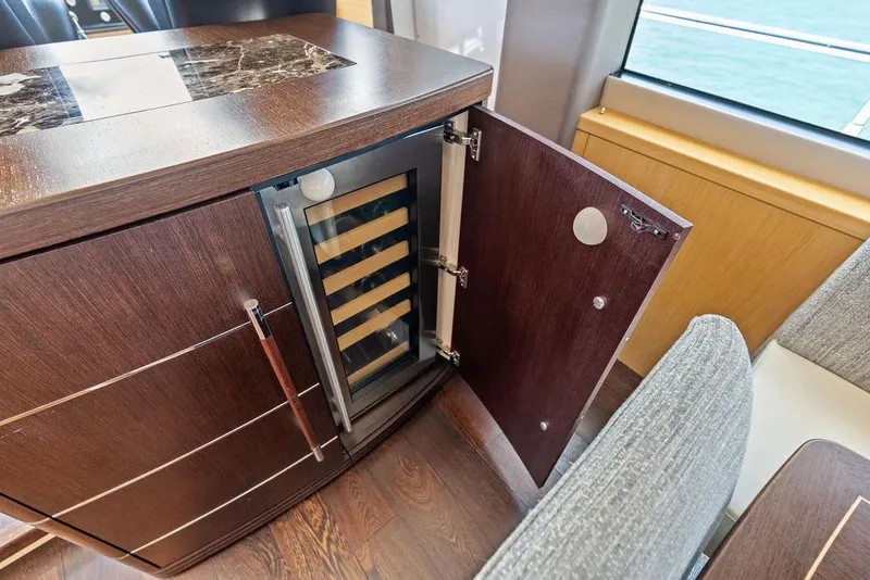 Slide: The Image of Luxury interior of 2018 Sunseeker 75 Sport Yacht with open wine cooler. - 47