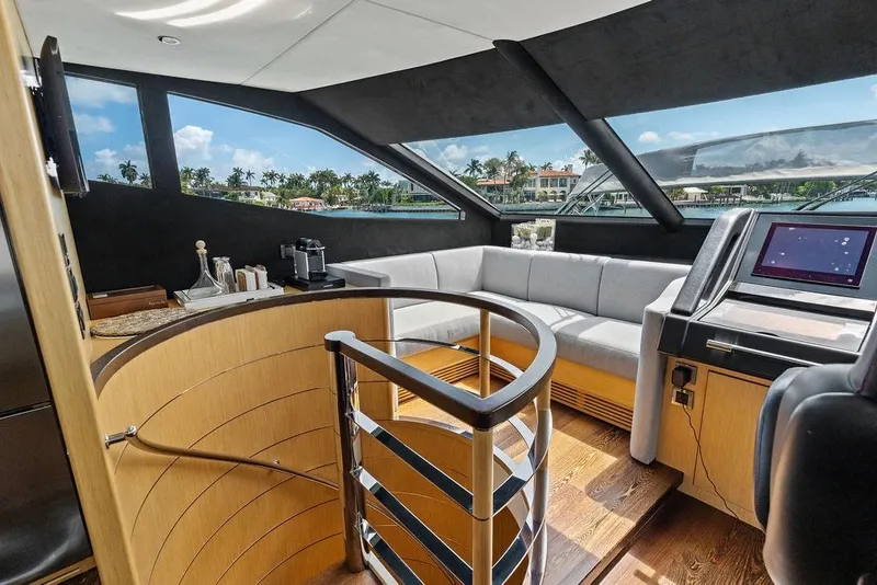Slide: The Image of Luxurious interior of 2018 Sunseeker 75 Sport Yacht with modern seating and navigation area. - 49