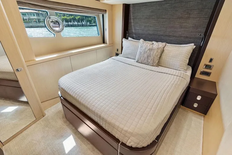 Slide: The Image of Luxurious bedroom interior of 2018 Sunseeker 75 Sport Yacht with elegant bedding and window view. - 50