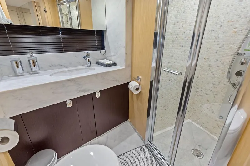 Slide: The Image of Luxurious bathroom in 2018 Sunseeker 75 Sport Yacht with marble sink and modern shower. - 63
