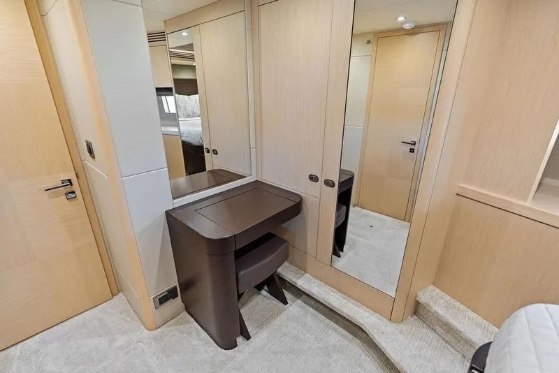 Slide: The Image of Luxurious interior of 2018 Sunseeker 75 Sport Yacht with elegant wood finishes and mirrored closet. - 65