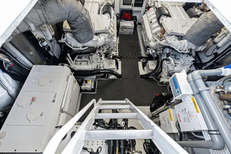 Slide: The Image of Engine room of 2018 Sunseeker 75 Sport Yacht, showcasing dual engines and mechanical systems. - 67