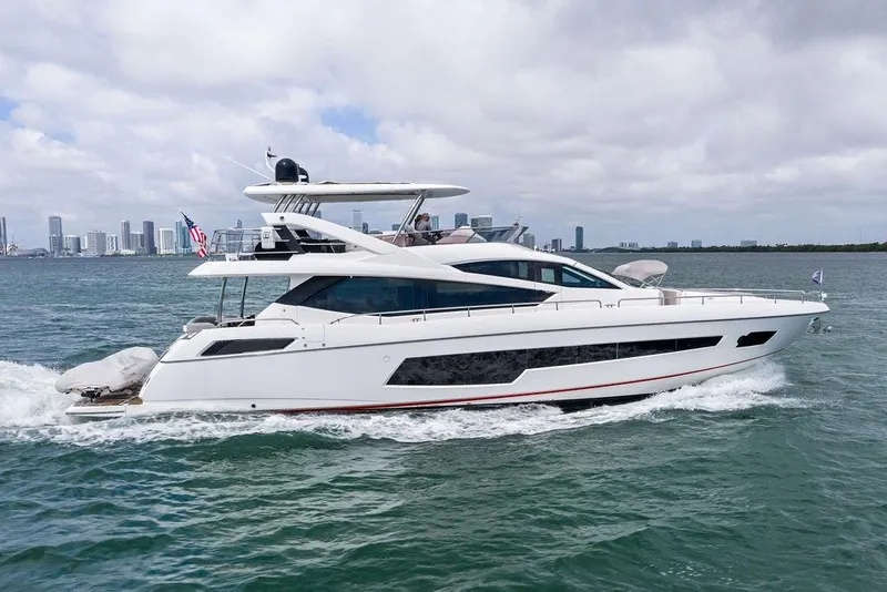Slide: The Image of 2018 Sunseeker 75 Sport Yacht cruising near city skyline on a cloudy day. - 7