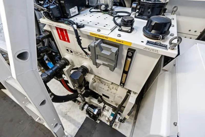 Slide: The Image of Engine room of 2018 Sunseeker 75 Sport Yacht, featuring hydraulic thruster system. - 71