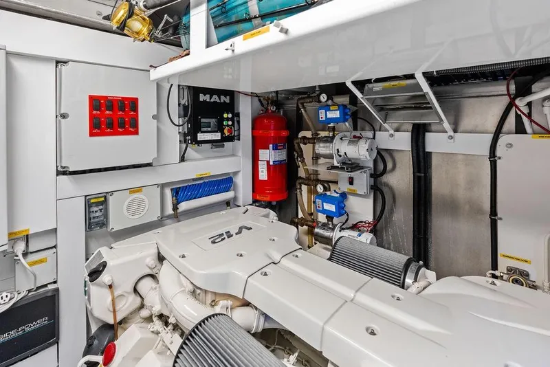 Slide: The Image of Engine room of 2018 Sunseeker 75 Sport Yacht, featuring MAN engine and safety equipment. - 72