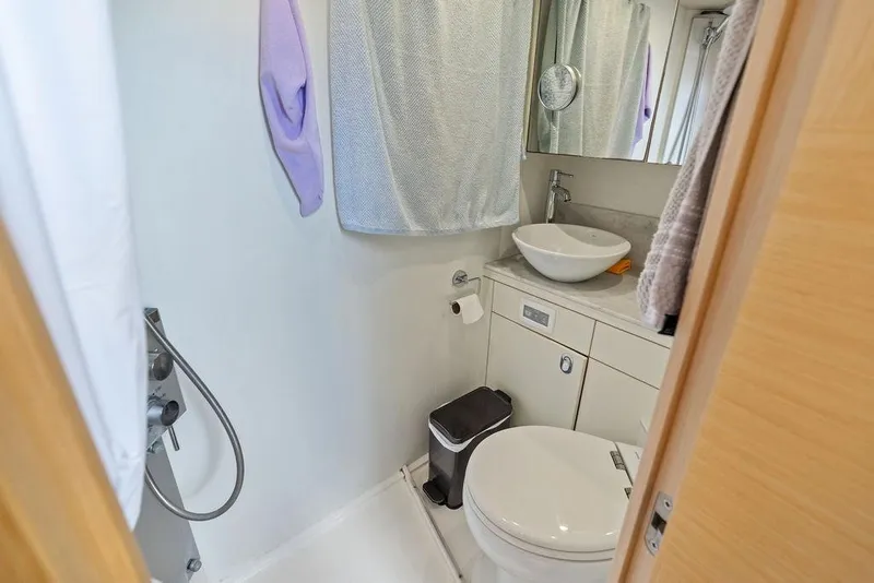Slide: The Image of Modern bathroom in 2018 Sunseeker 75 Sport Yacht with sink, toilet, and shower. - 79