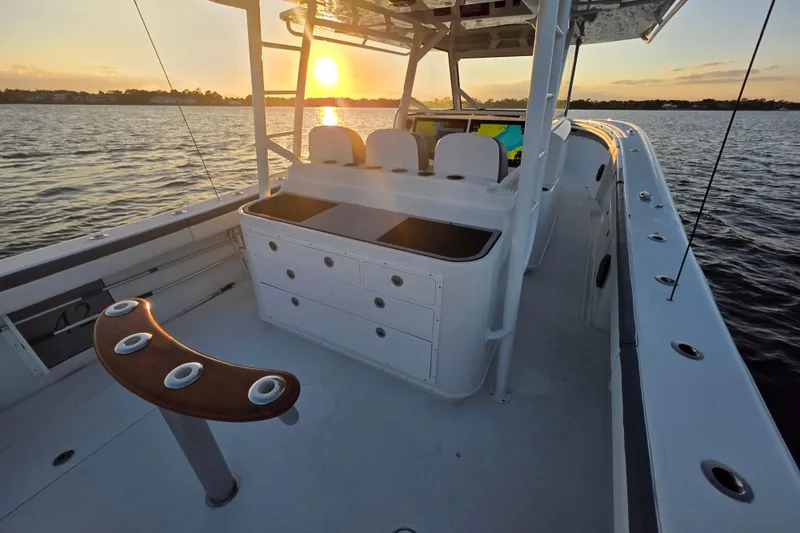 Slide: The Image of 2019 Yellowfin 42 Offshore boat at sunset on calm waters. - 11