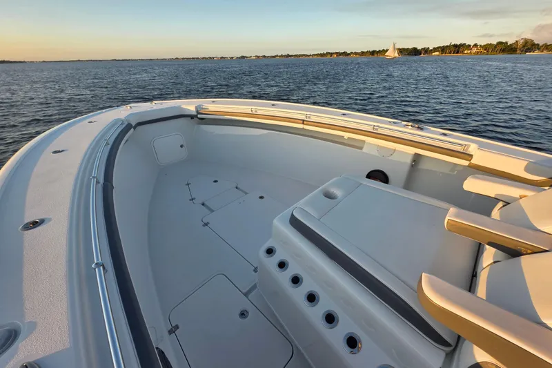 Slide: The Image of 2019 Yellowfin 42 Offshore boat deck with ocean view at sunset. - 15