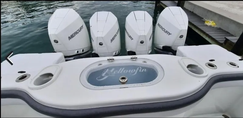Slide: The Image of 2019 Yellowfin Center Console boat with four Mercury engines at dock. - 22